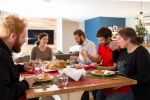 Home Inspectors Miami a family eating in the dining room