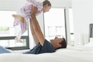 father and child happily playing - home inspection miami