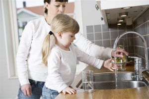 mother and daughter on the kitchen sink - home inspection miami